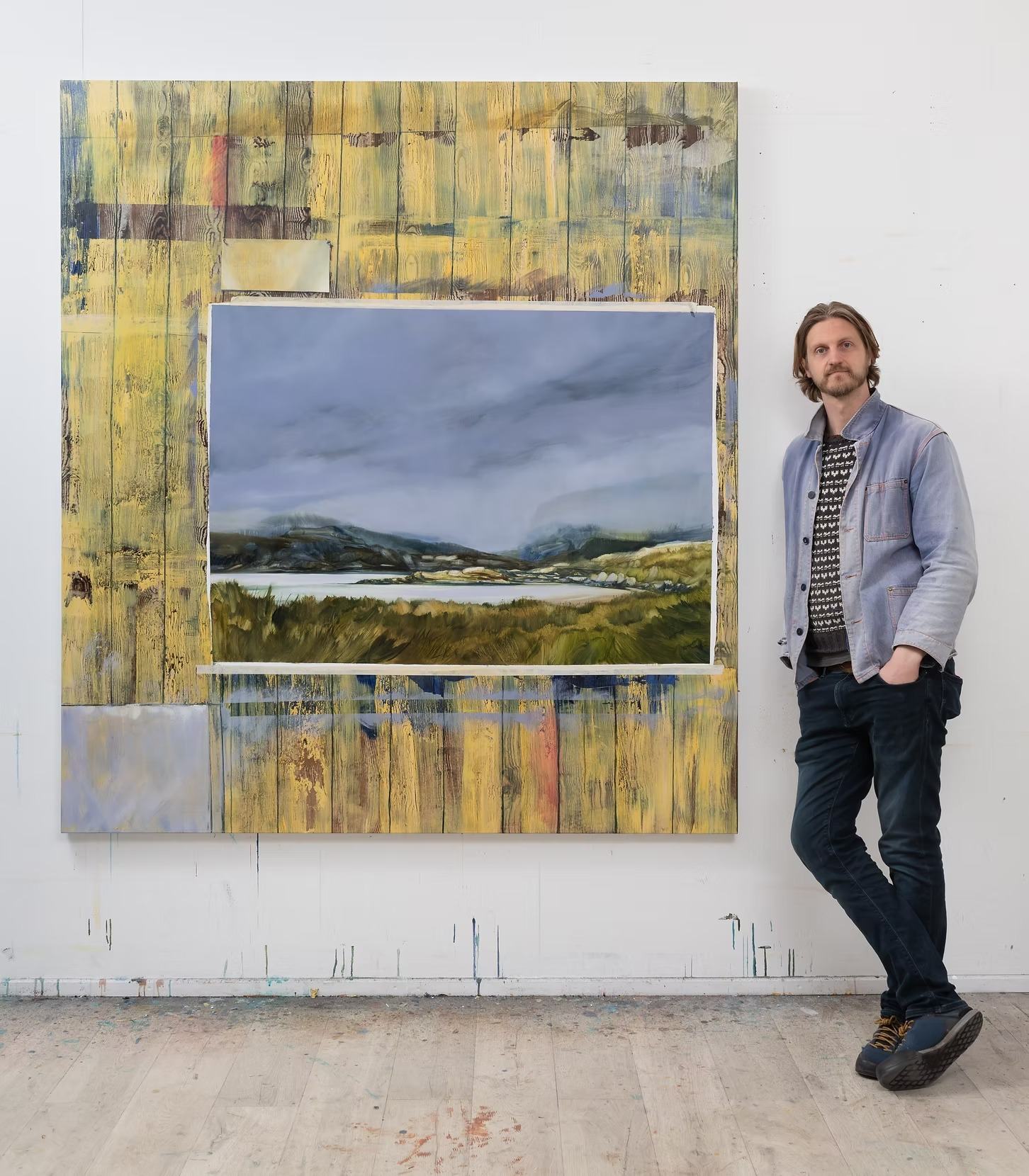 Painter Alastair Gordon in his studio beside his work, who took up the first Rock House artist residency in 2017